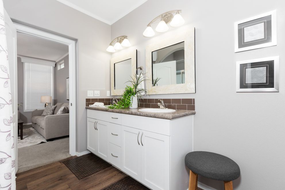 The ENCHANTMENT 3070A Primary Bathroom. This Manufactured Mobile Home features 3 bedrooms and 2 baths.