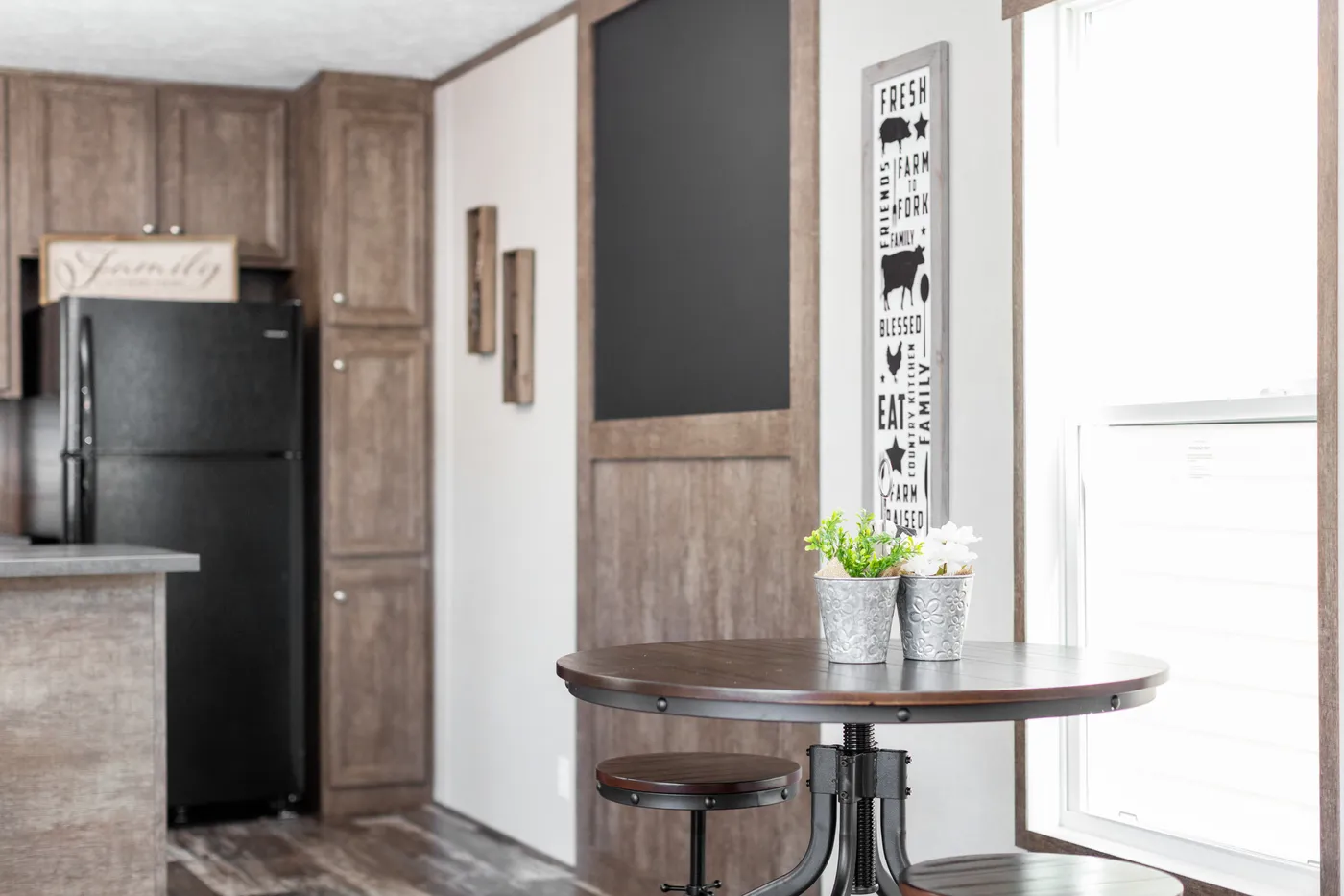 The THE BREEZE Dining Area. This Manufactured Mobile Home features 3 bedrooms and 2 baths.