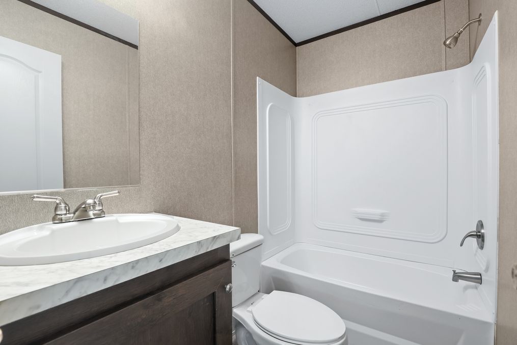 The THE ANNIVERSARY SPLASH Guest Bathroom. This Manufactured Mobile Home features 3 bedrooms and 2 baths.