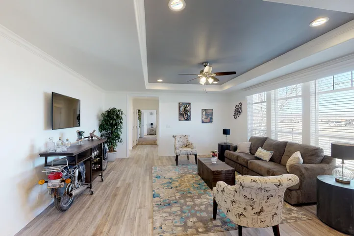 The SUM3068A Living Room. This Manufactured Mobile Home features 3 bedrooms and 2 baths.