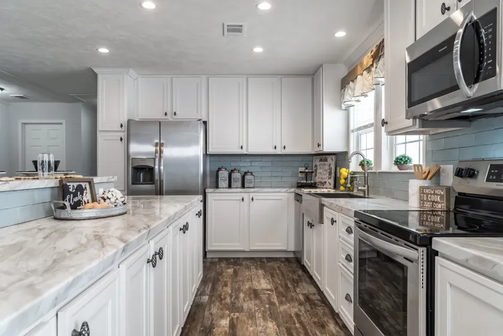 The THE LEAHY Kitchen. This Manufactured Mobile Home features 4 bedrooms and 2 baths.