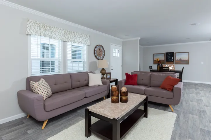 The THE FREEDOM BREEZE Living Room. This Manufactured Mobile Home features 3 bedrooms and 2 baths.