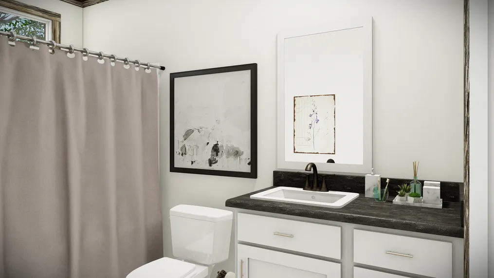 The THE SUMNER Guest Bathroom. This Manufactured Mobile Home features 3 bedrooms and 2 baths.