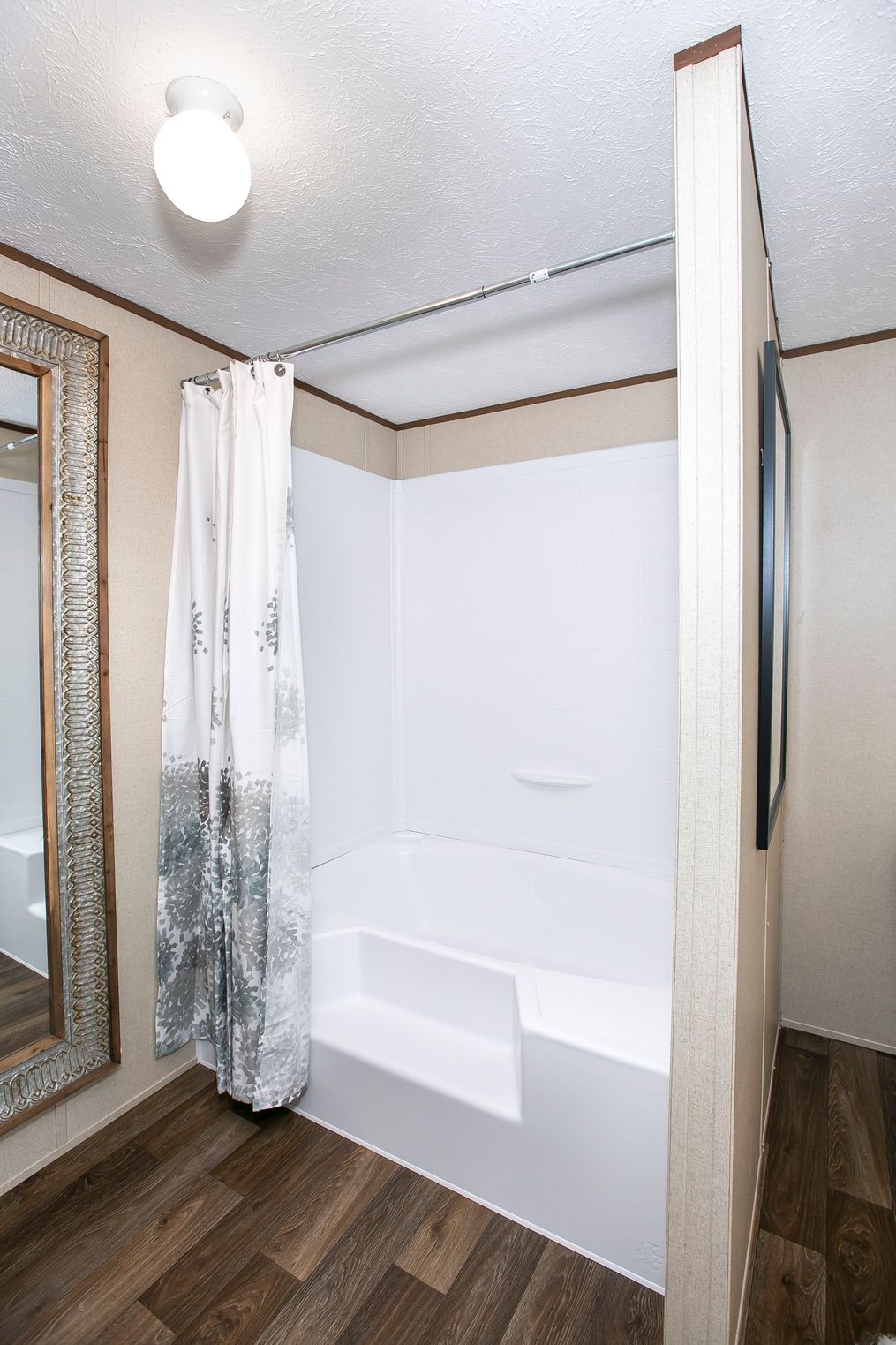 The TRIUMPH Primary Bathroom. This Manufactured Mobile Home features 5 bedrooms and 3 baths.