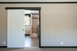 The THE FRANKLIN Primary Bedroom. This Manufactured Mobile Home features 3 bedrooms and 2 baths.