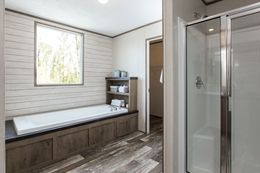 The THE NEW BREEZE II Master Bathroom. This Manufactured Mobile Home features 4 bedrooms and 2 baths.