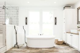 The THE LULABELLE Primary Bathroom. This Manufactured Mobile Home features 4 bedrooms and 3 baths.