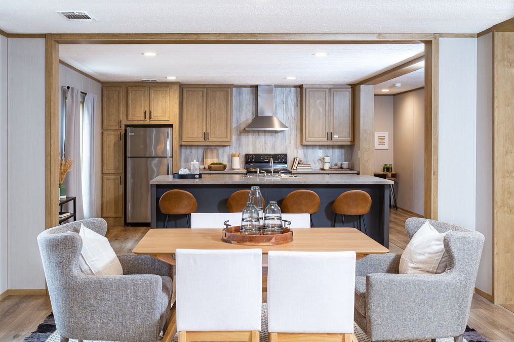 The EVEREST Dining Area. This Manufactured Mobile Home features 4 bedrooms and 2 baths.