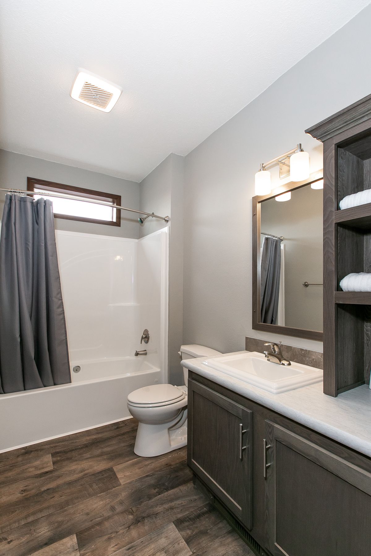 The FREEDOM 66 Guest Bathroom. This Manufactured Mobile Home features 3 bedrooms and 2 baths.