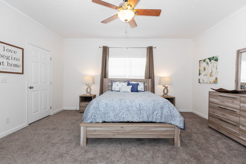 The 2095 HERITAGE Primary Bedroom. This Manufactured Mobile Home features 3 bedrooms and 2 baths.