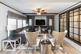 The THE HAMPTON BAY Living Room. This Manufactured Mobile Home features 3 bedrooms and 2 baths.