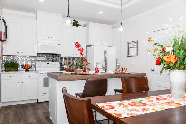 The 1439 CAROLINA "MAGNOLIA" Kitchen. This Manufactured Mobile Home features 3 bedrooms and 2 baths.
