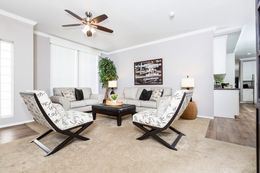 The ENCHANTMENT 3070A Living Room. This Manufactured Mobile Home features 3 bedrooms and 2 baths.