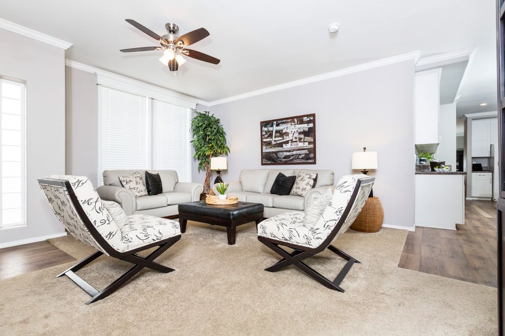 The ENCHANTMENT 3070A Living Room. This Manufactured Mobile Home features 3 bedrooms and 2 baths.