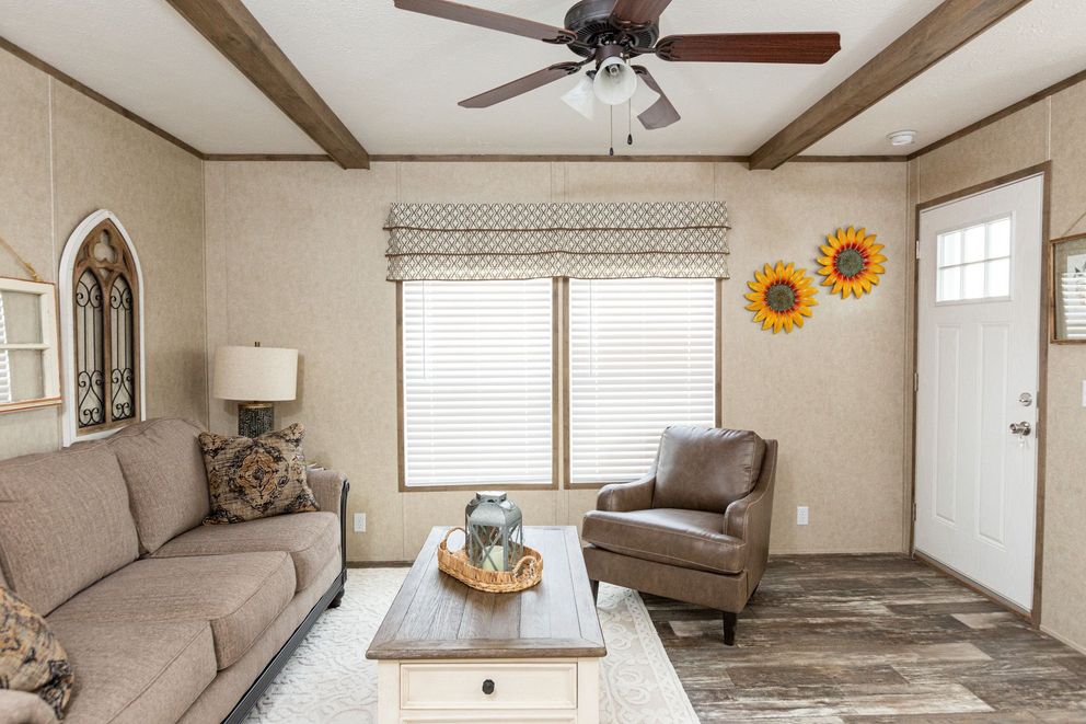 The THE RANCH HOUSE Living Room. This Manufactured Mobile Home features 3 bedrooms and 2 baths.