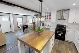 The BREEZE FARMHOUSE 72 Kitchen. This Manufactured Mobile Home features 4 bedrooms and 2 baths.