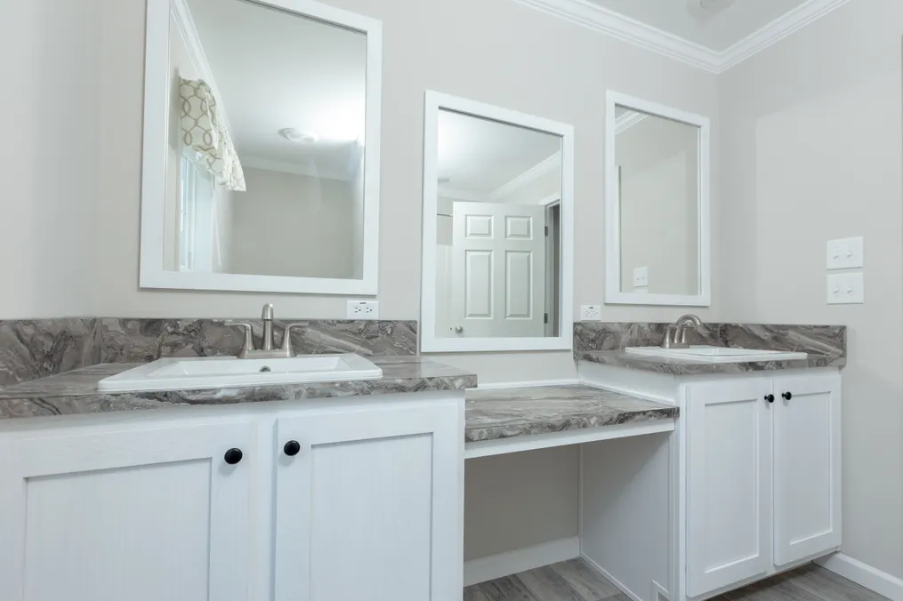 The THE FREEDOM BREEZE Guest Bathroom. This Manufactured Mobile Home features 3 bedrooms and 2 baths.