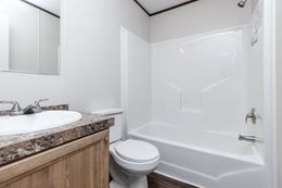 The THE ANNIVERSARY 16 Guest Bathroom. This Manufactured Mobile Home features 3 bedrooms and 2 baths.
