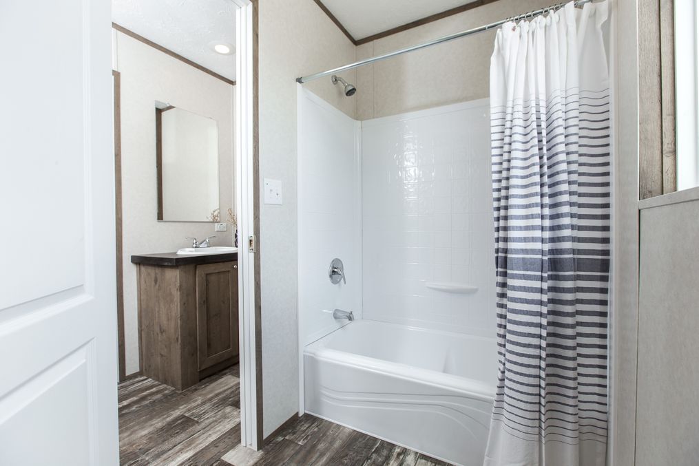 The THE BREEZE 2.5         CLAYTON Guest Bathroom. This Manufactured Mobile Home features 4 bedrooms and 2 baths.