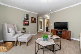 The 5604 ENTERPRISE 4 6428 Living Room. This Manufactured Mobile Home features 3 bedrooms and 2 baths.