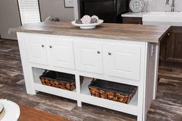 The THE ANNIVERSARY ISLANDER Kitchen. This Manufactured Mobile Home features 3 bedrooms and 2 baths.