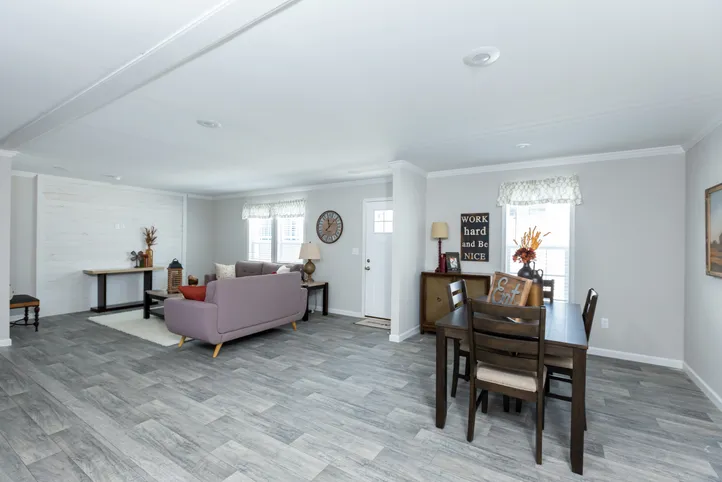 The THE FREEDOM BREEZE Dining Area. This Manufactured Mobile Home features 3 bedrooms and 2 baths.