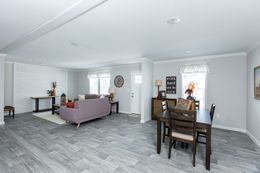 The THE FREEDOM BREEZE Dining Area. This Manufactured Mobile Home features 3 bedrooms and 2 baths.