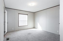 The BLAZER 76 4A Primary Bedroom. This Manufactured Mobile Home features 4 bedrooms and 2 baths.