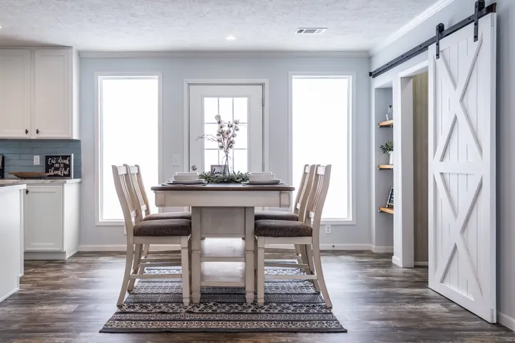 The THE LEAHY Dining Area. This Manufactured Mobile Home features 4 bedrooms and 2 baths.