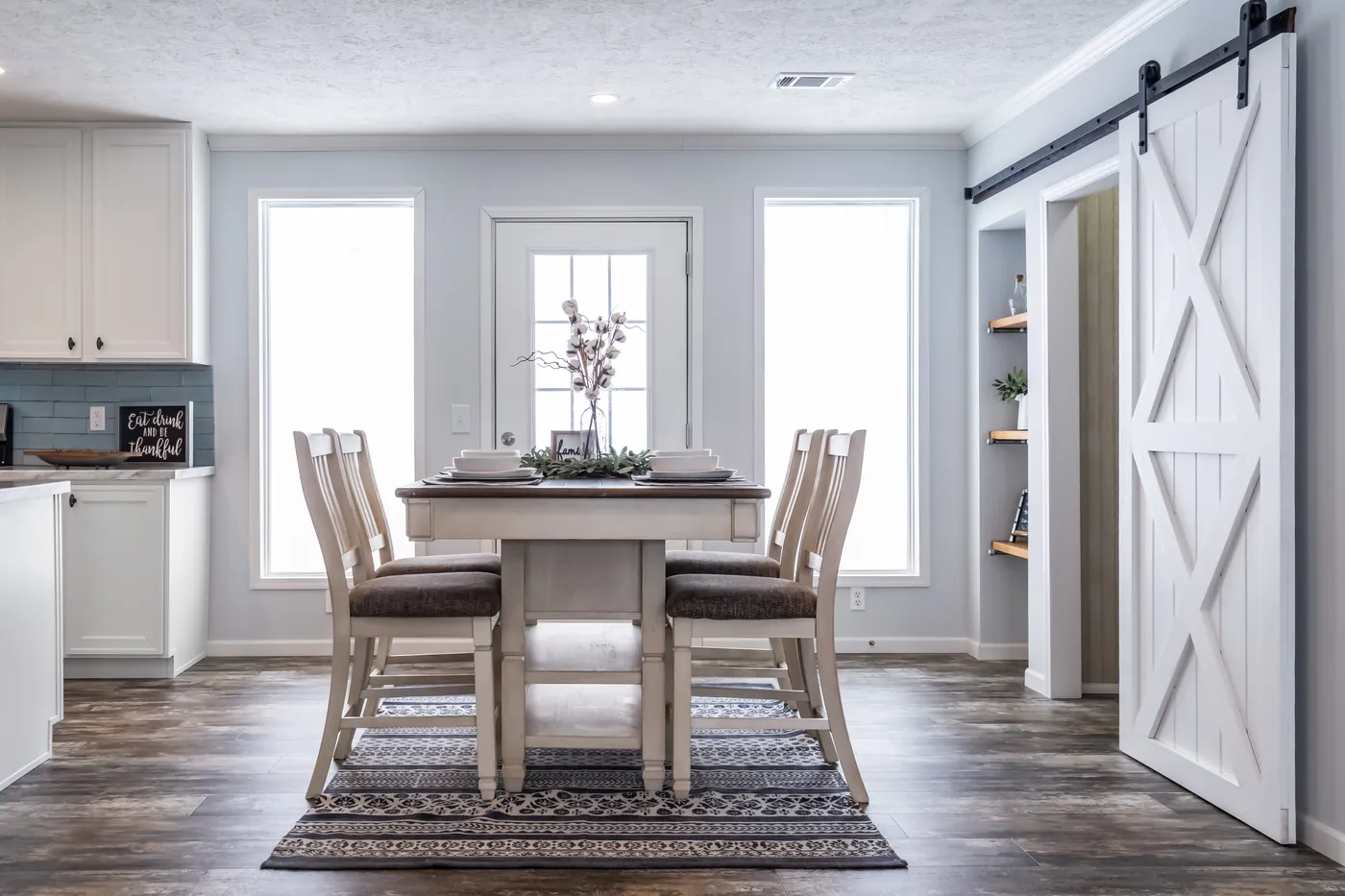 The THE LEAHY Dining Area. This Manufactured Mobile Home features 4 bedrooms and 2 baths.
