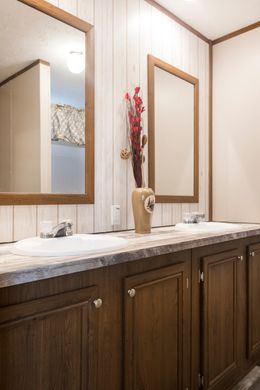 The THE LODGE Primary Bathroom. This Manufactured Mobile Home features 2 bedrooms and 2 baths.