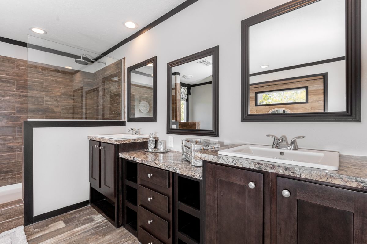 The THE FRANKLIN XL Master Bathroom. This Manufactured Mobile Home features 4 bedrooms and 2 baths.
