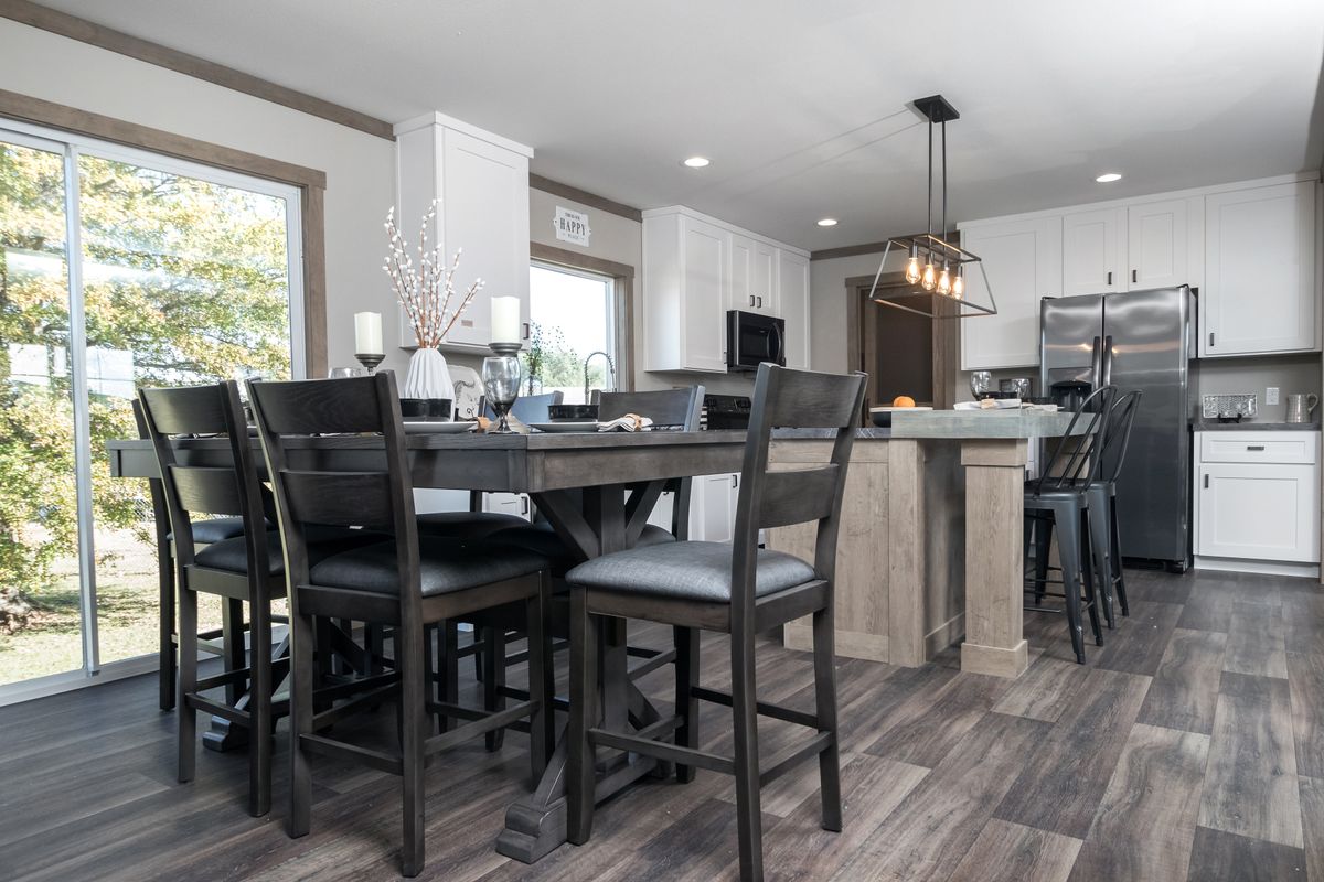 The AMELIA Dining Area. This Manufactured Mobile Home features 4 bedrooms and 2 baths.