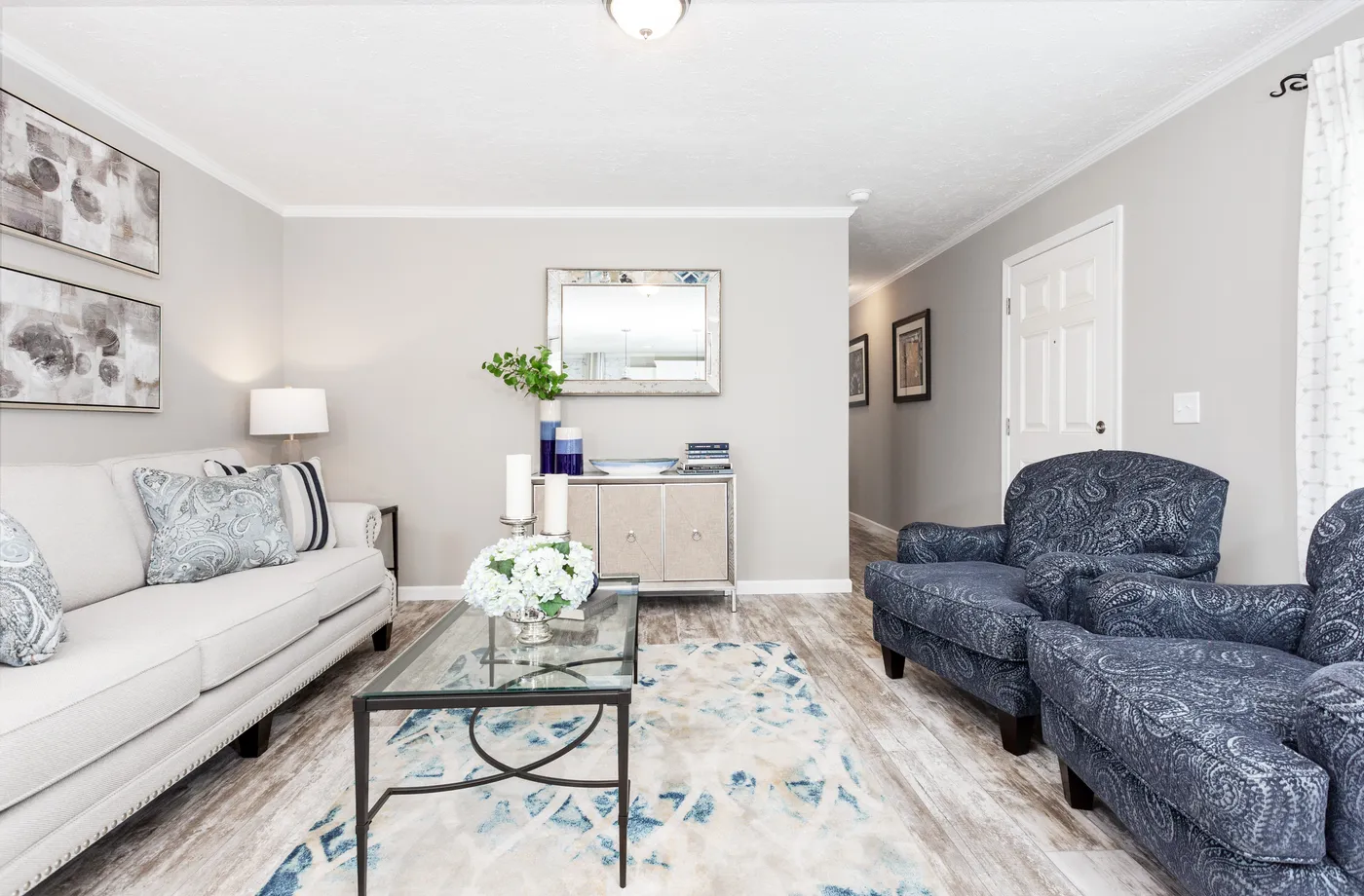 The 777 "COOL BREEZE" 7616 Living Room. This Manufactured Mobile Home features 3 bedrooms and 2 baths.