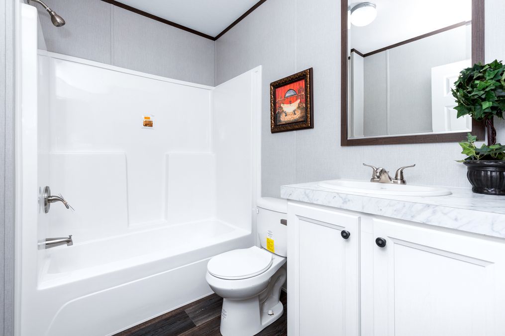 The THE CHOICE Guest Bathroom. This Manufactured Mobile Home features 4 bedrooms and 2 baths.
