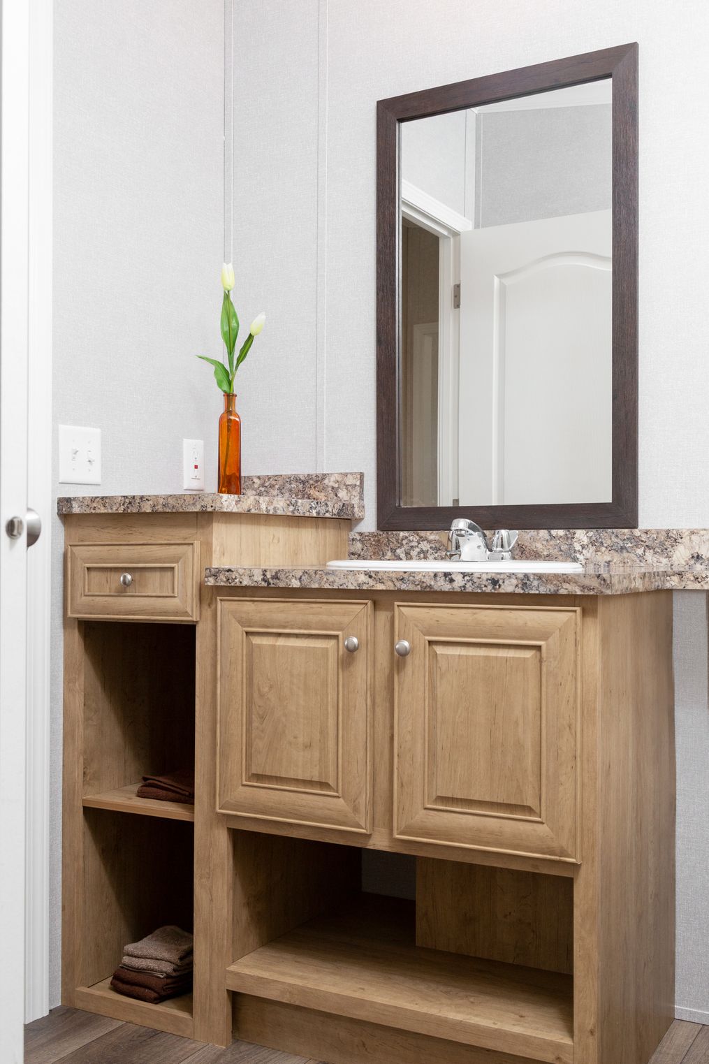 The SHEER ELM Guest Bathroom. This Manufactured Mobile Home features 3 bedrooms and 2 baths.