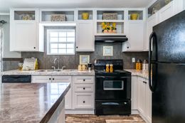 The TRADITION 2868B Kitchen. This Manufactured Mobile Home features 4 bedrooms and 2 baths.