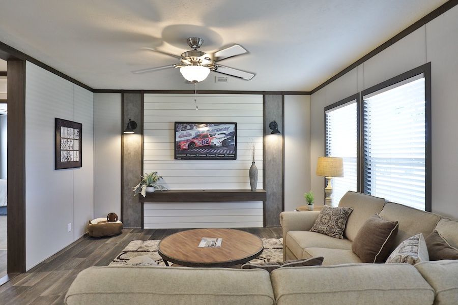 The BREEZE FARMHOUSE Living Room. This Manufactured Mobile Home features 3 bedrooms and 2 baths.