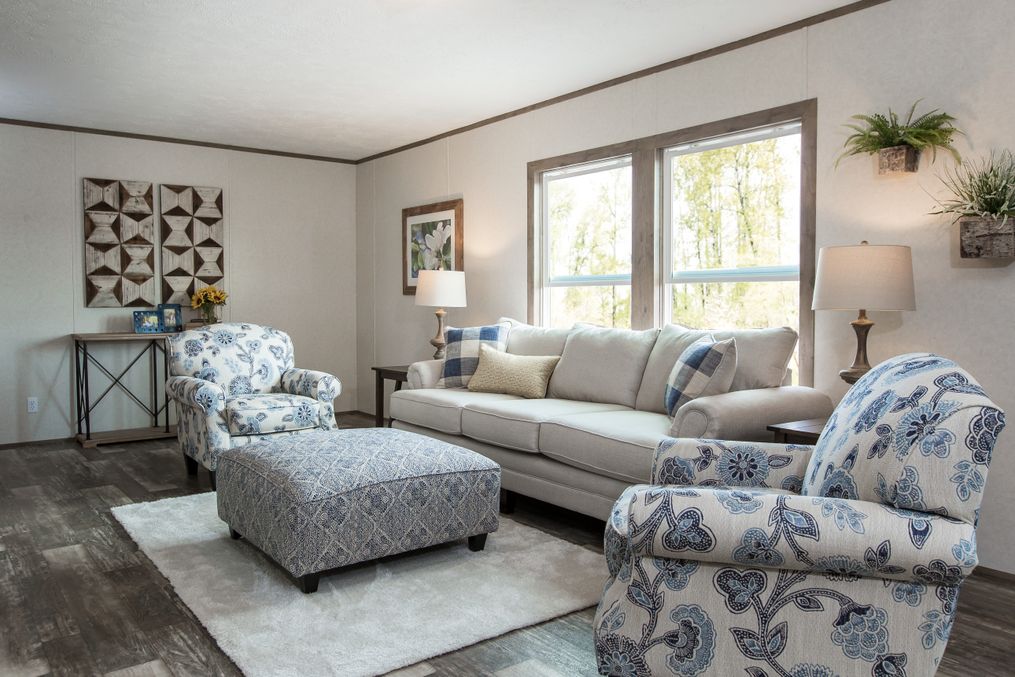 The THE BREEZE II Living Room. This Manufactured Mobile Home features 4 bedrooms and 2 baths.