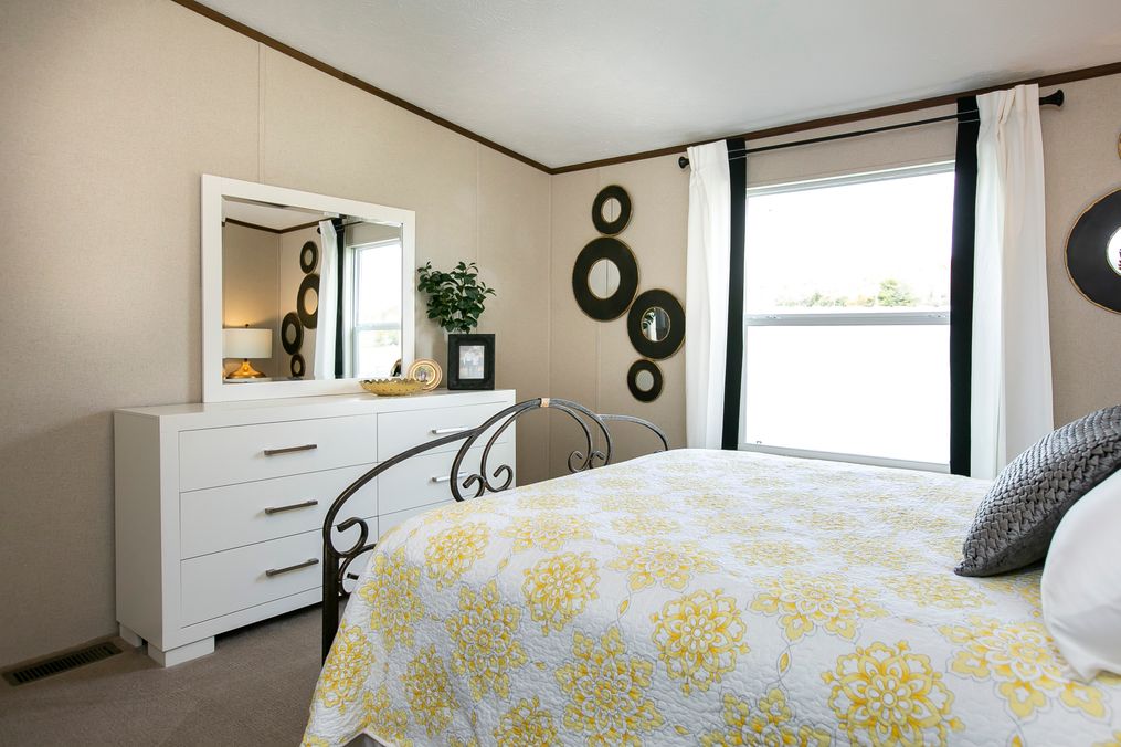 The TRIUMPH Guest Bedroom. This Manufactured Mobile Home features 5 bedrooms and 3 baths.