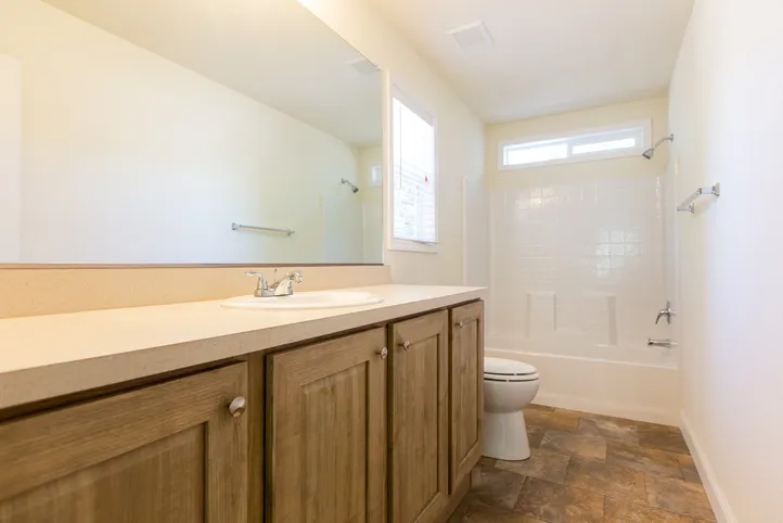 The FAIRPOINT 24403A Primary Bathroom. This Manufactured Mobile Home features 3 bedrooms and 2 baths.