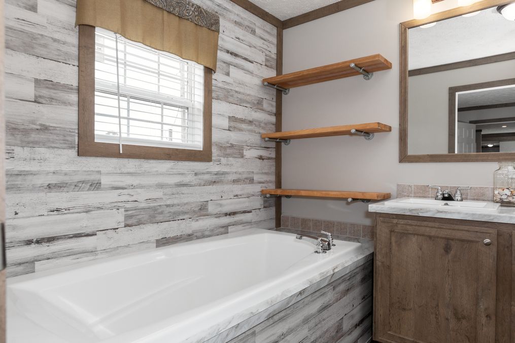 The THE WALSH Primary Bathroom. This Manufactured Mobile Home features 3 bedrooms and 2 baths.