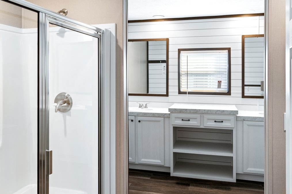 The BREEZE FARMHOUSE Primary Bathroom. This Manufactured Mobile Home features 3 bedrooms and 2 baths.