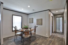 The BREEZE FARMHOUSE Dining Area. This Manufactured Mobile Home features 3 bedrooms and 2 baths.