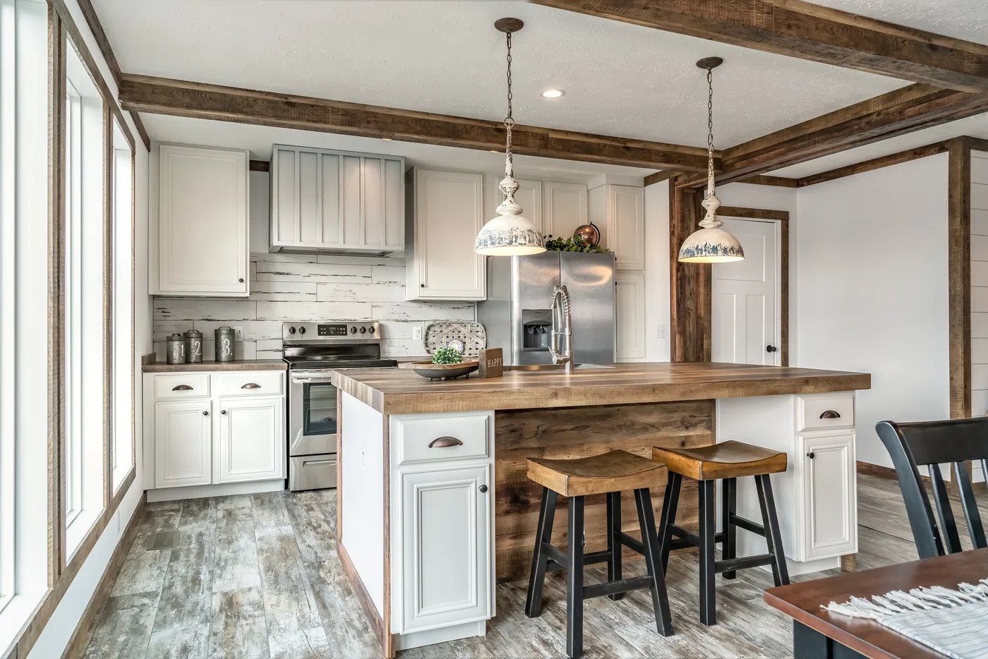 The THE AVALYN Kitchen. This Manufactured Mobile Home features 3 bedrooms and 2 baths.