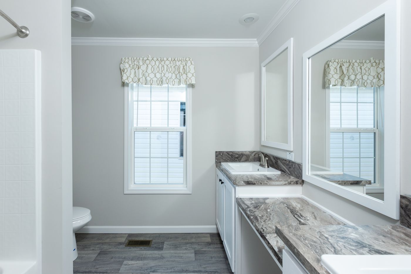 The THE FREEDOM BREEZE Guest Bathroom. This Manufactured Mobile Home features 3 bedrooms and 2 baths.