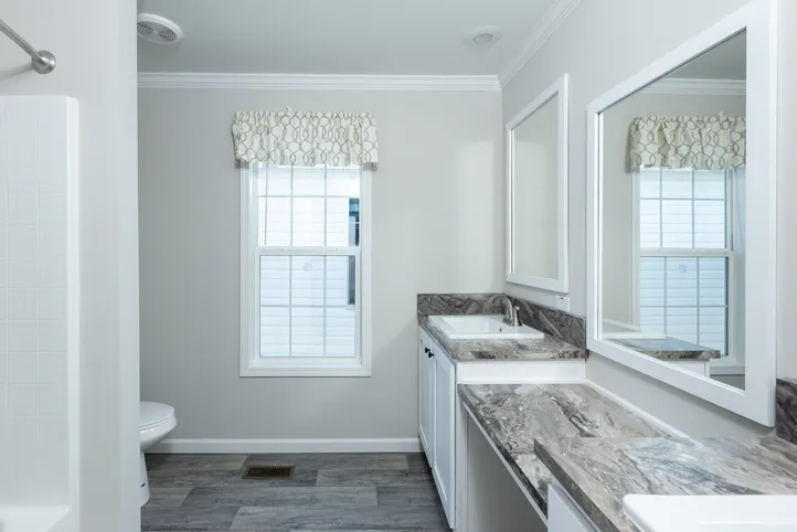 The THE FREEDOM BREEZE Guest Bathroom. This Manufactured Mobile Home features 3 bedrooms and 2 baths.