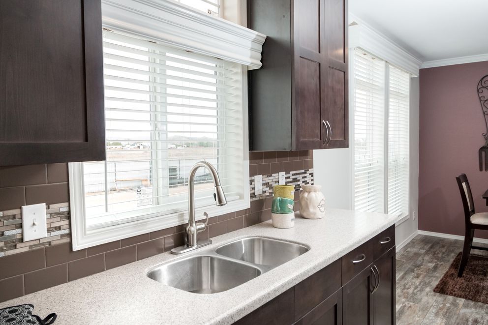 The ENCHANTMENT 3070A Kitchen. This Manufactured Mobile Home features 3 bedrooms and 2 baths.