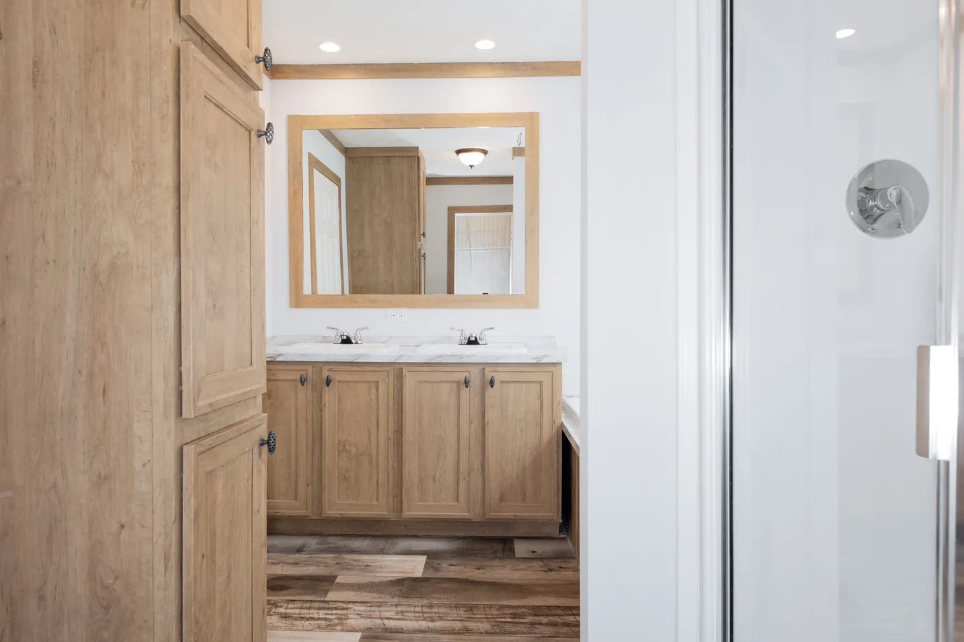 The THE BEXAR Primary Bathroom. This Manufactured Mobile Home features 3 bedrooms and 2 baths.