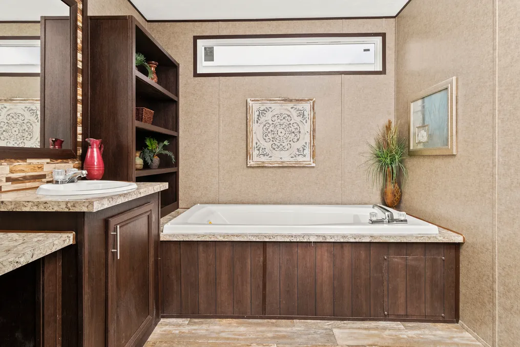 The THE PARKSIDE Primary Bathroom. This Manufactured Mobile Home features 3 bedrooms and 2 baths.